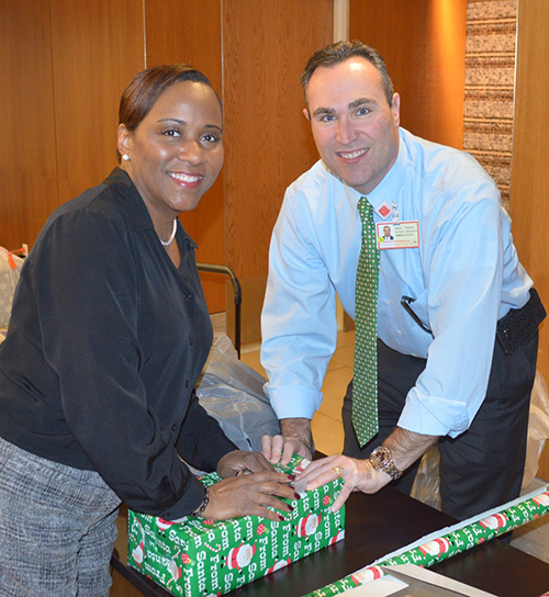 Santa’s Helpers Wrapping Party attendees Sedrick and Tonjal Photo 1